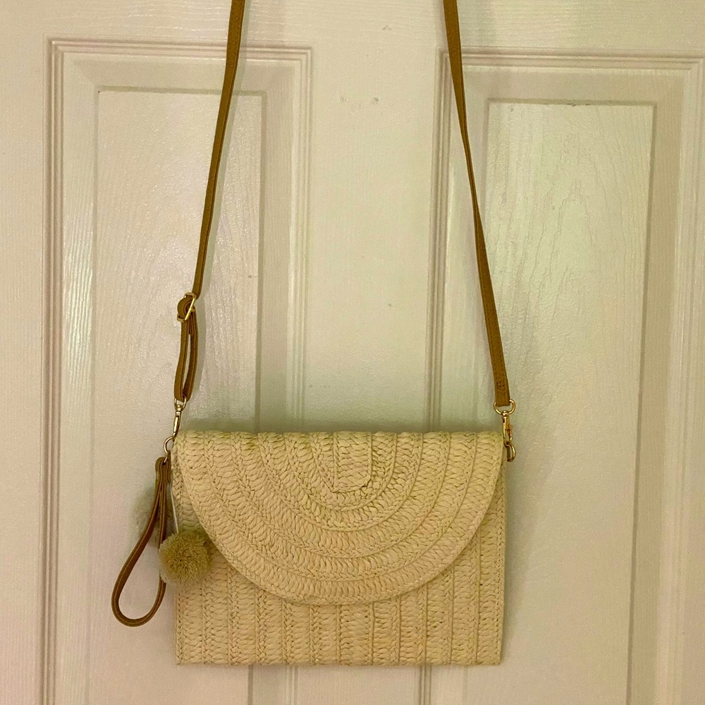 Woven crossbody envelope bag.
